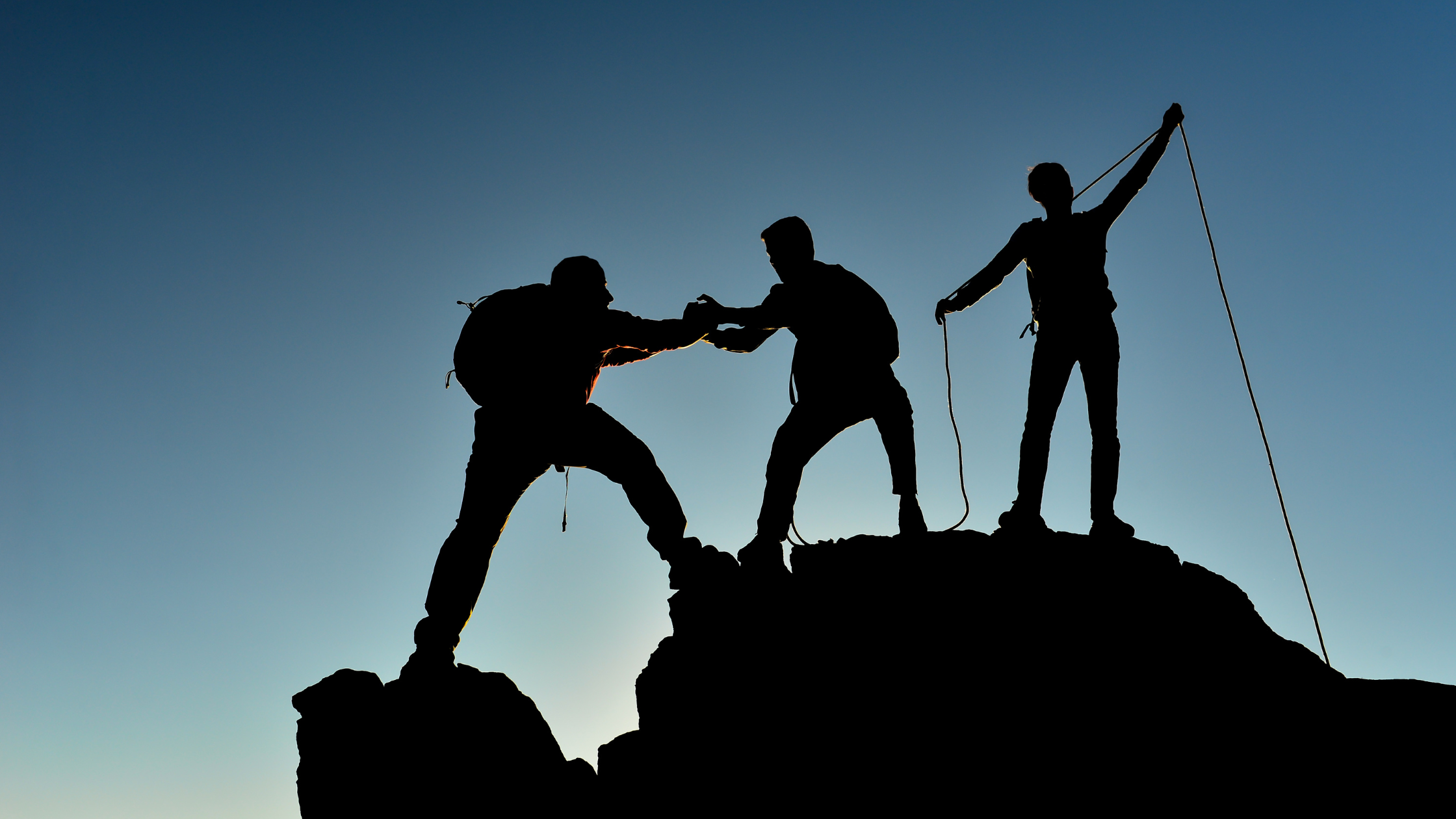 team climbing hill